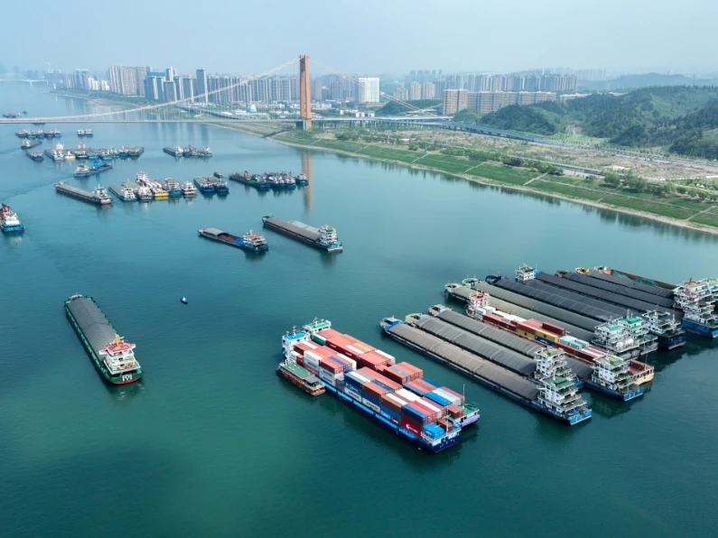Cargo barges and container vessels on the river — 70% waterway transport
